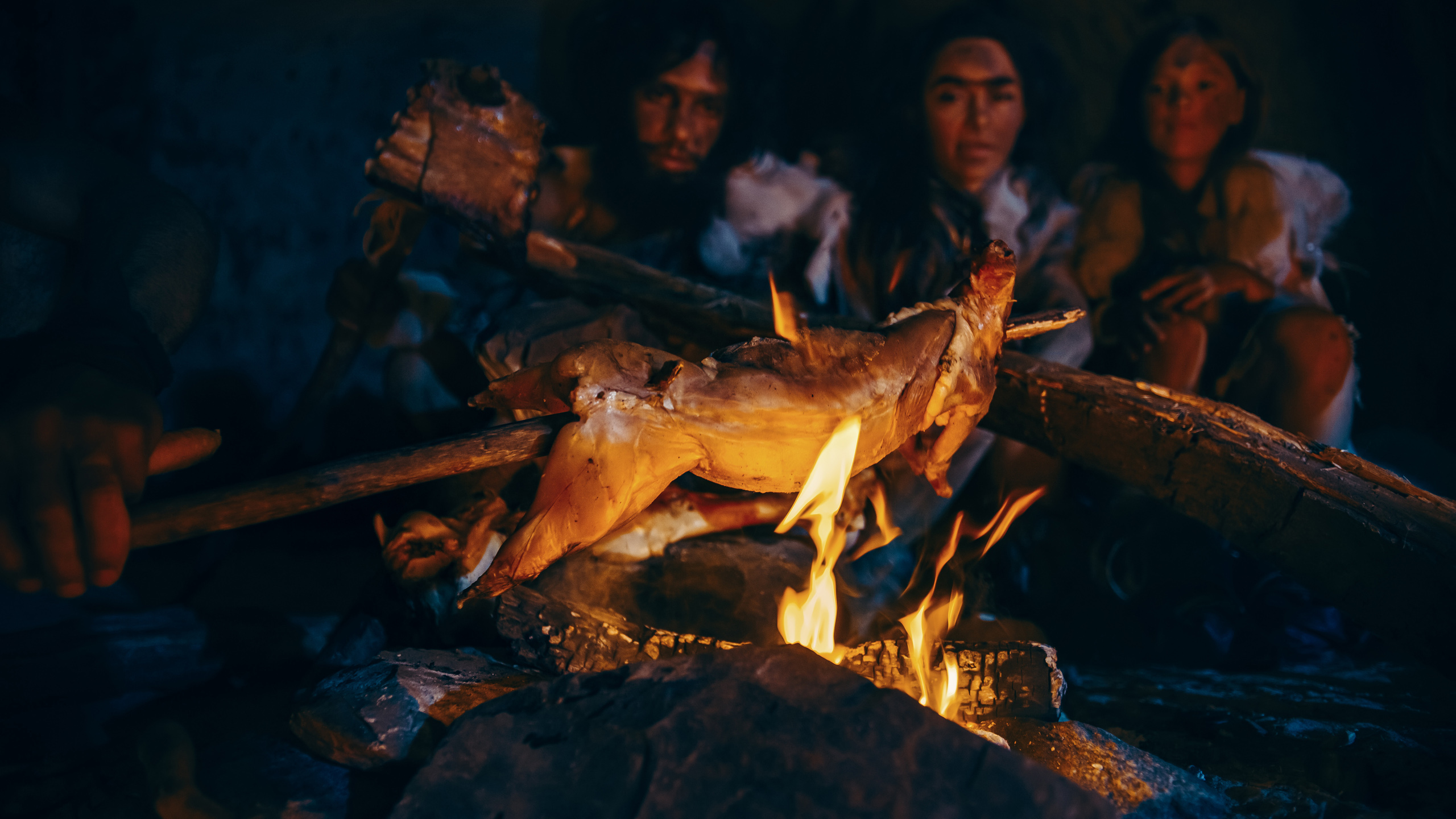 Neanderthal,Or,Homo,Sapiens,Family,Cooking,Animal,Meat,Over,Bonfire